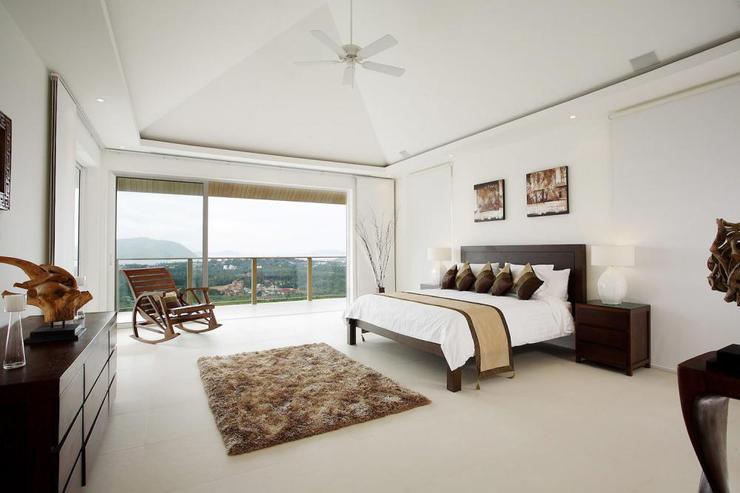 Spacious master bedroom with king-size bed and stunning sea views