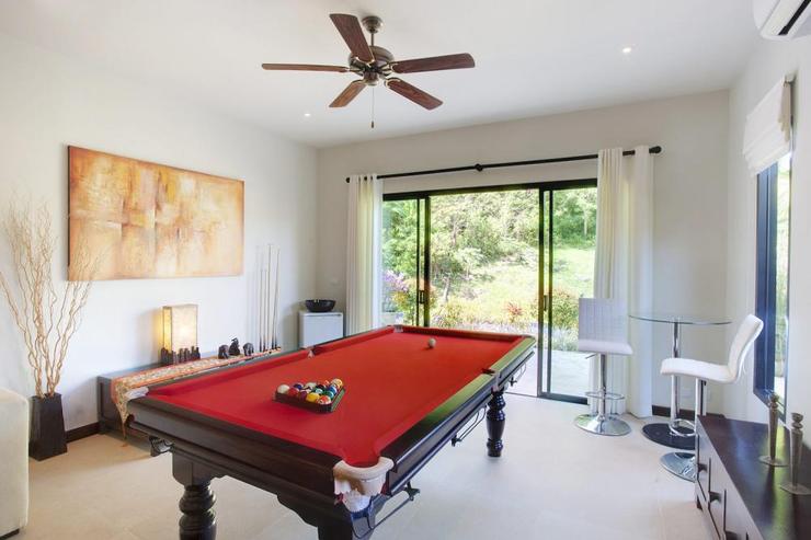 Games room with pool table and direct access to the sundeck and swimming pool