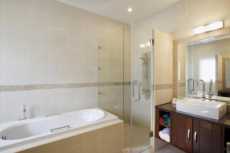 Bedroom 2 bathroom, with bath, shower and twin vanity units