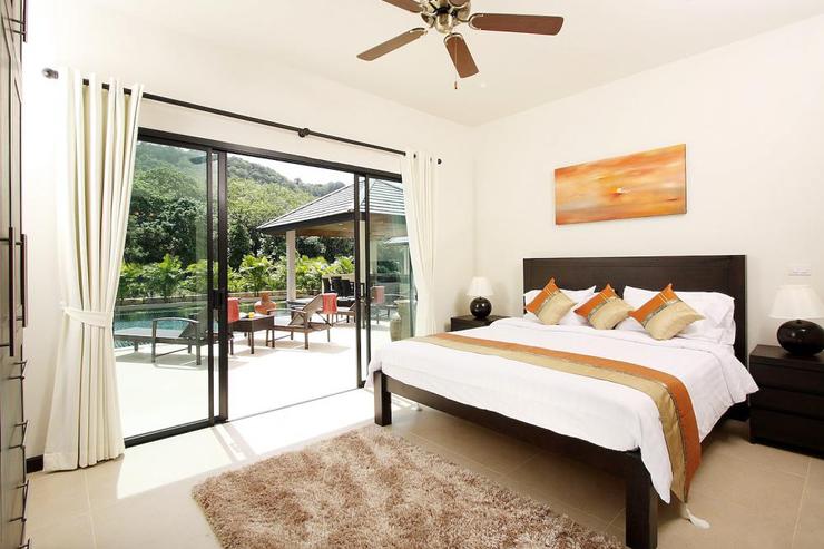 Bedroom 4 with sliding doors and direct access to swimming pool and sun deck