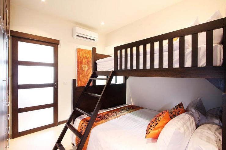 Bedroom 6 with queen size bed and single bed above, complete with air conditioning and shared en-suite bathroom