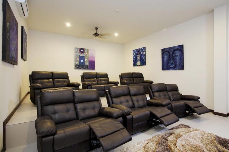 12-seater cinema room with reclining chairs and big screen projector