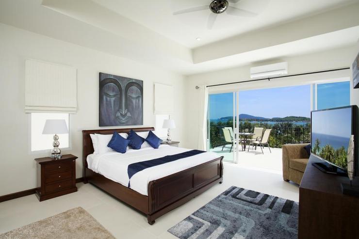 Bedroom 4 with king-size bed, en-suite bathroom, flat screen TV, and direct access onto upper balcony with seaviews