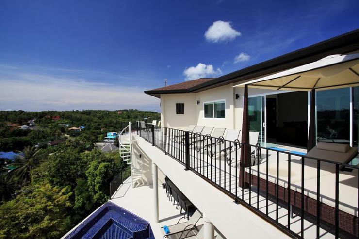 The upper balcony is located above the infinitiy-edge swimming pool and lower sundeck