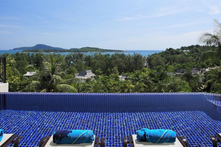 Infinity-edge swimming pool with integral jacuzzi, overlooking the Andaman Sea