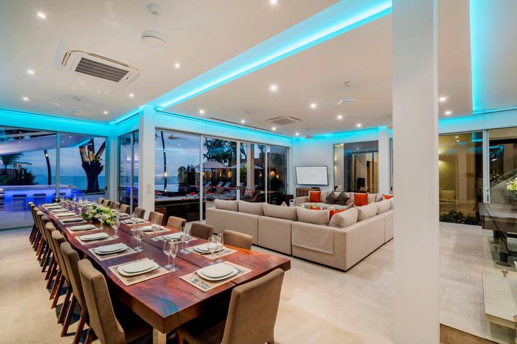 Light and airy open-plan living spaces with beautiful views across the pool and white sands of Ao Yon beach, the perfect place to dine and relax together.
