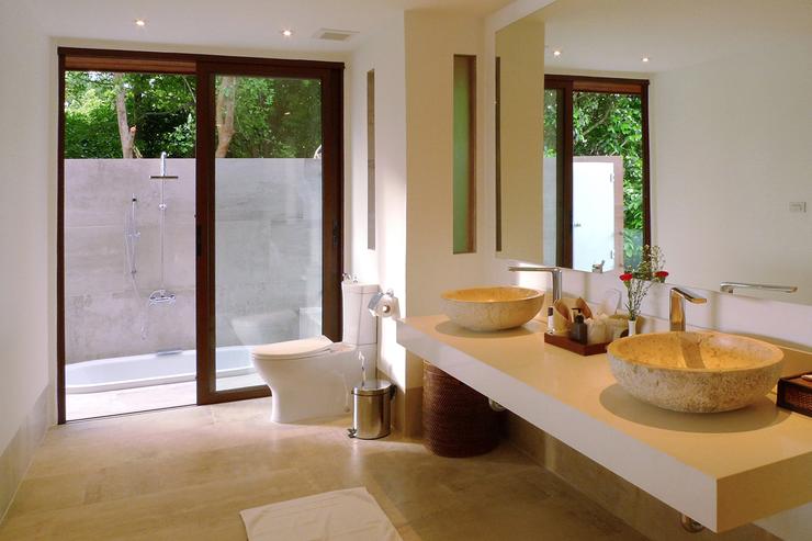 Both bathroom 2 (shown here) and bathroom 3 enjoy an outdoor garden bathroom with a sunken bath tub and a second shower.
