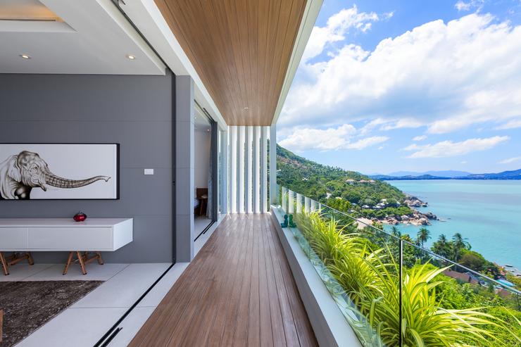 Villa Channary -Resplendent floor-to-ceiling sliding glass doors open widely on a covered wooden balcony to let you relax with the soft sea-breeze by the bedrooms