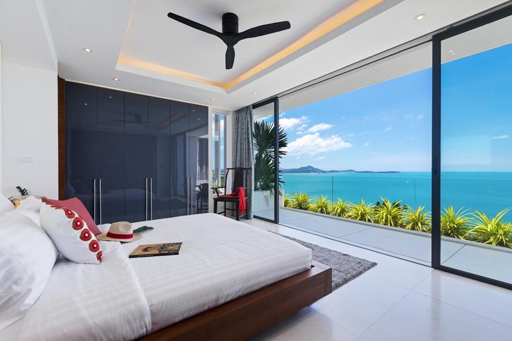 Villa Hanuman - Resplendent floor-to-ceiling glass doors open widely on a covered balcony to let you relax with the soft sea-breeze by the master bedroonm