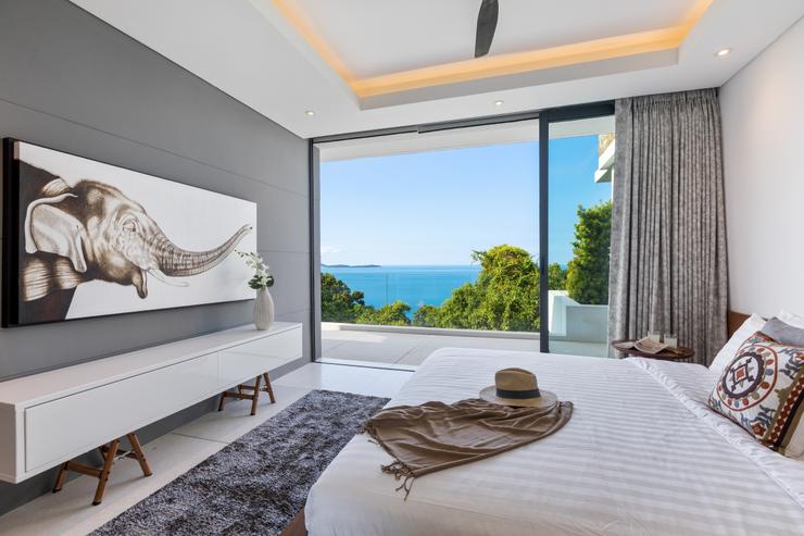 Villa Veasna - Resplendent floor-to-ceiling siding glass doors open widely on a covered balcony to let you relax with the soft sea-breeze by the bedroom